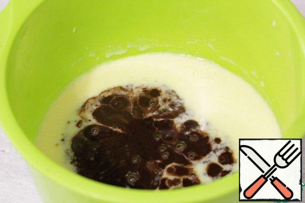 Then pour in the cooled chocolate mixture and mix well again.