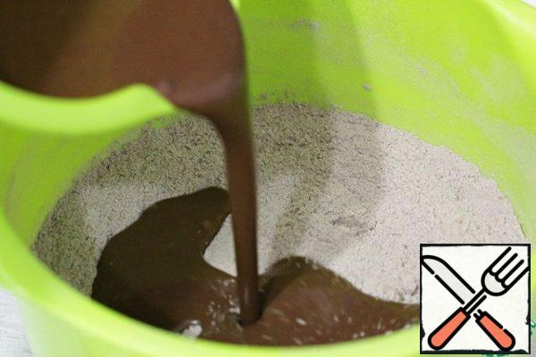 Add the liquid ingredients to the flour mixture and mix until smooth.