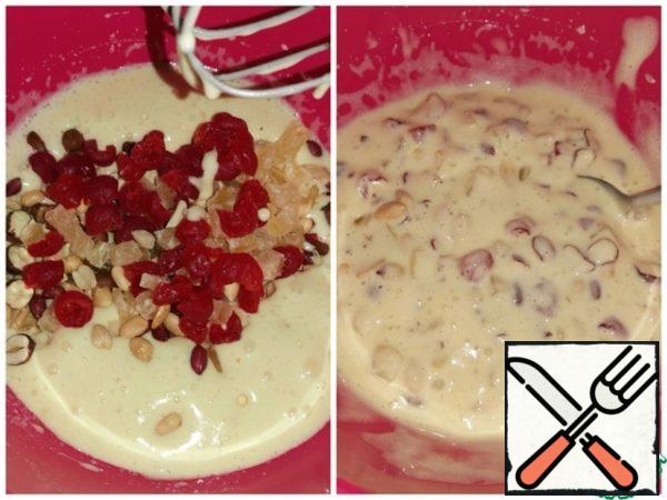 Add the hazelnuts, peanuts, cherries, and pineapple and mix. 