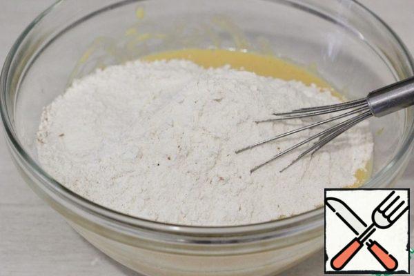 Add the flour mixture to the liquid ingredients.