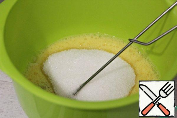 Add sugar and beat well with a whisk.