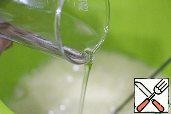 Pour in the vegetable oil and beat again.