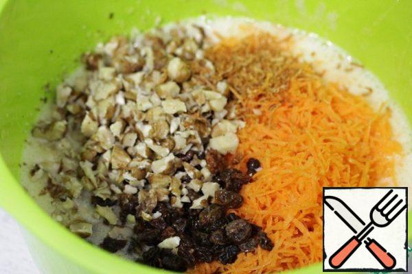 Add grated carrots, nuts and raisins.