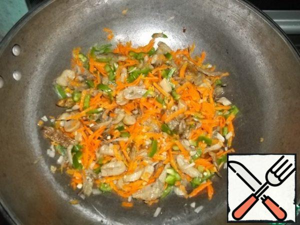 Add carrots and bell pepper. Stirring, cook for 5 minutes, add the garlic, vinegar, and finely chopped hot pepper passed through the press. This dish definitely needs a light sprinkle to balance the neutral taste of vegetables.