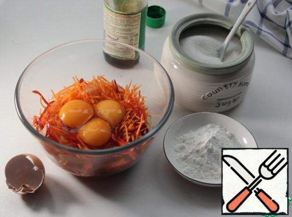 Put the chopped vegetables in a bowl, beat in three eggs, add soy sauce, sugar, and starch.