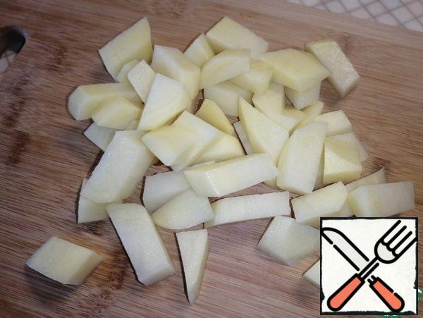 Add the coarsely chopped potatoes to the pan and add the rice. Cook for 10-15 minutes.