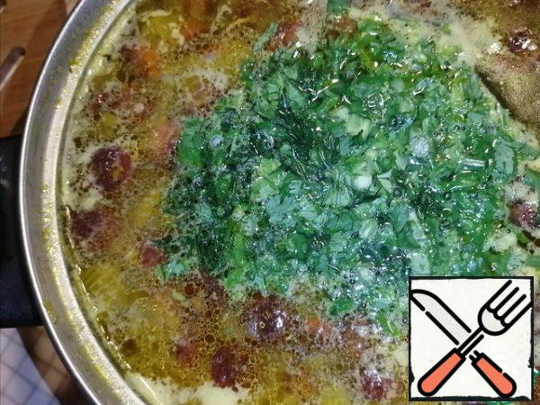 Add coarsely chopped greens. Cook for another 10 minutes. 