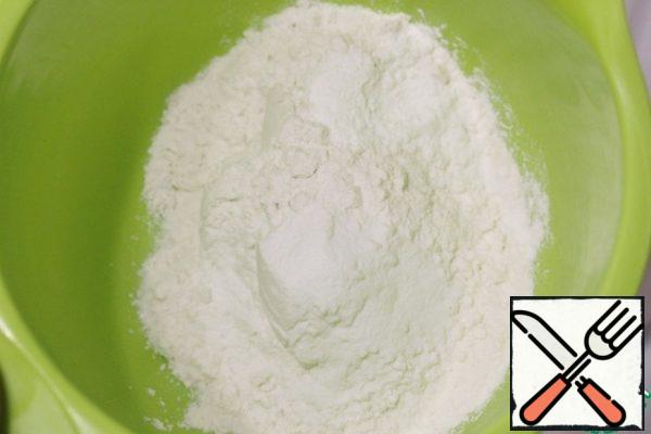 Add flour, baking soda and baking powder to a bowl and mix well.