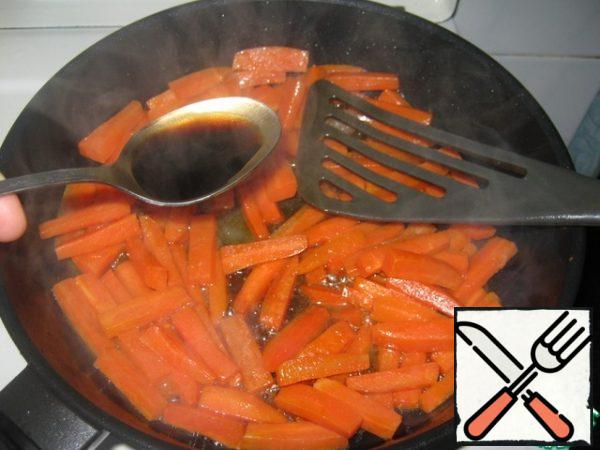 Add the wine and simmer for 15 minutes, stirring occasionally, until the wine has completely evaporated.  Add honey and soy sauce to the carrots, stir and cook for another 10 minutes.