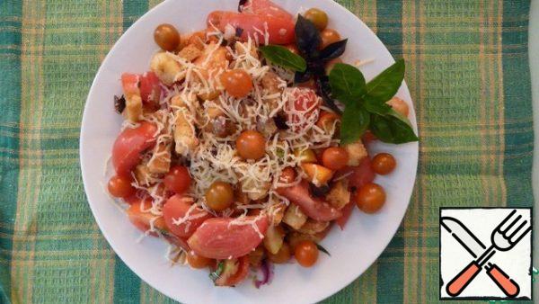 Mix all the ingredients of the salad. Top with grated cheese and Basil sprigs.