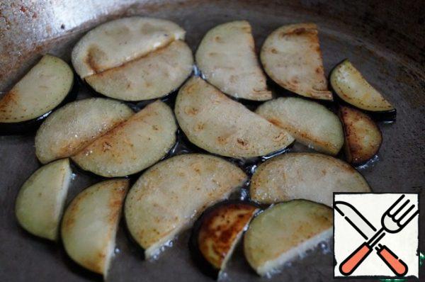 Mix Soy sauce and rice vinegar. fry the eggplants in vegetable oil until golden brown, and put them in a separate bowl.