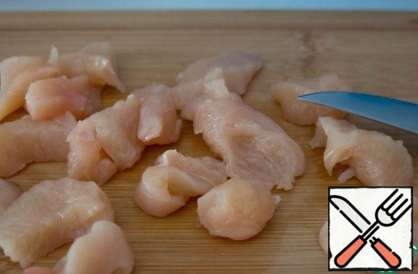 Cut the chicken breast into small pieces.