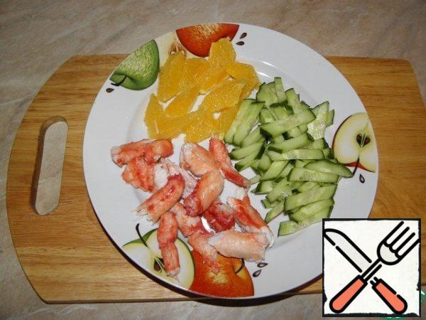 Cucumber cut into strips, orange and crab meat cubes (in general, pieces of what you like).