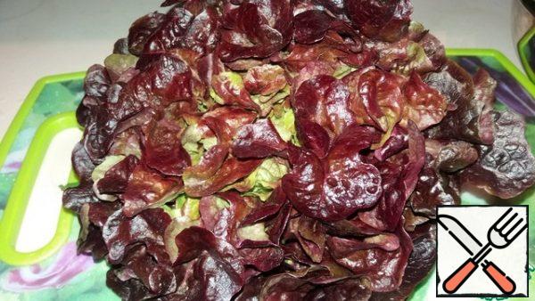 Tear or cut the  lettuce.
