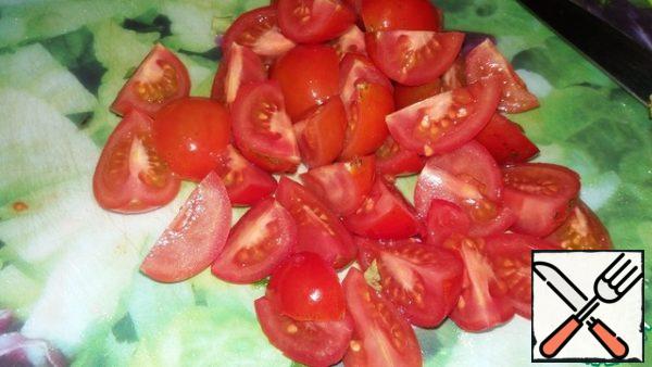 Cherry tomatoes cut into halves or quarters.