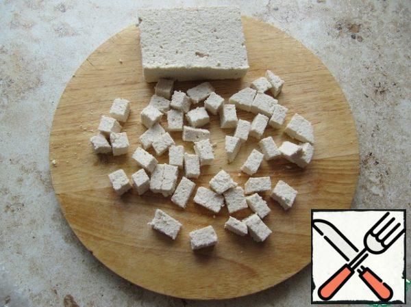 Cut tofu cheese into cubes.