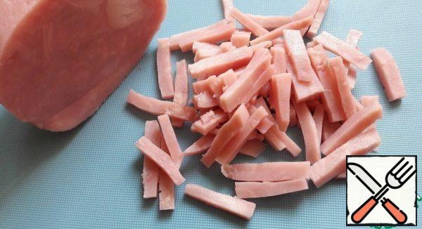 Cut the ham into chunks.