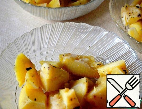 Cut the baked potatoes into slices-put them in a salad bowl, sprinkle with your favorite seasonings, I have a Provencal mixture.