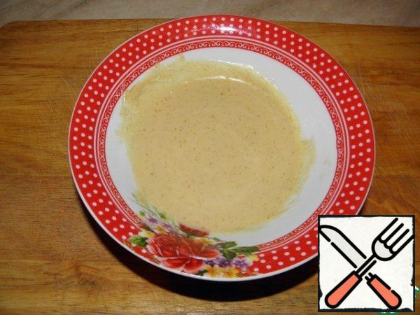 Add the mustard, olive oil and mayonnaise, whisking all the time.