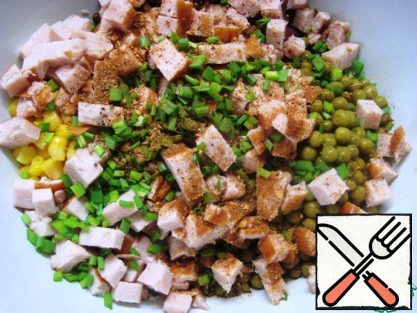 Add finely chopped green onions and season with a mixture of peppers and spices.