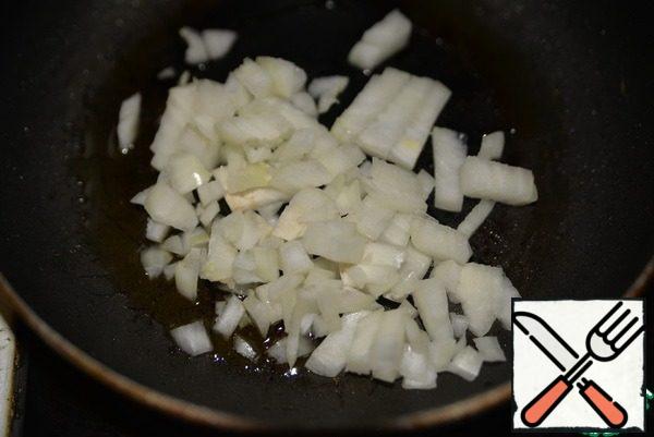 Onions cut into small cubes and fry in vegetable oil until transparent.