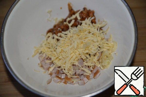 Add the grated cheese and squeeze out the garlic.