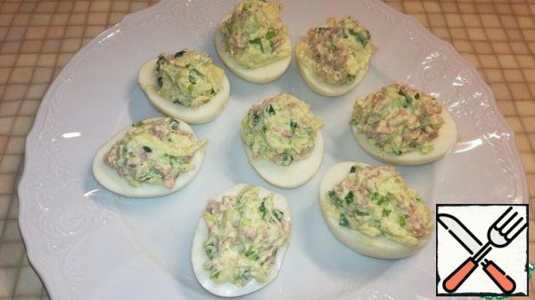 Mix well and fill the protein halves.
