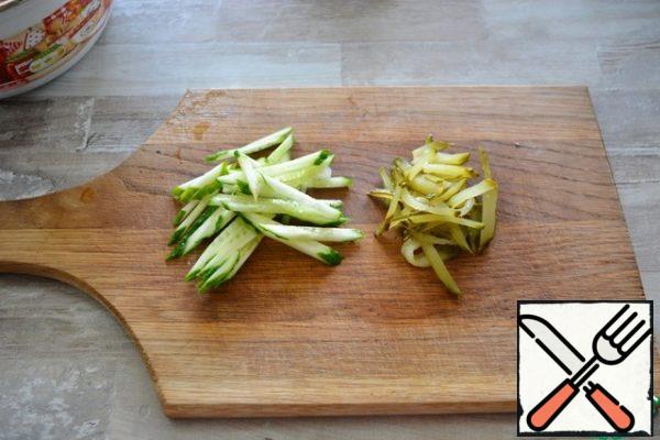 also, cut fresh and pickled cucumber into strips.