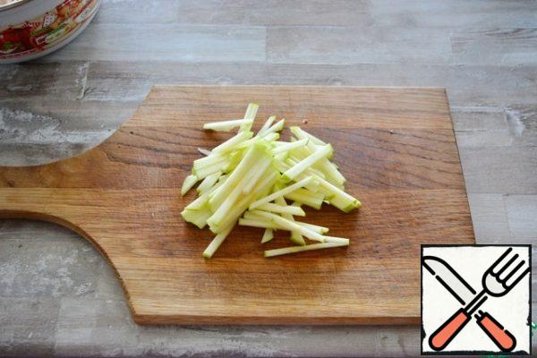 cut the green apple into strips.