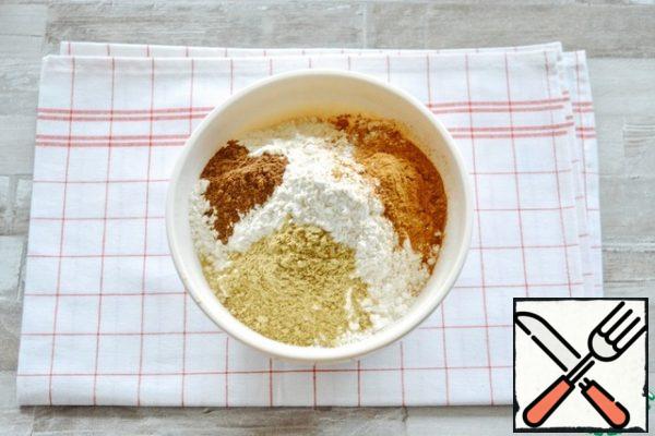 Sift the flour into a bowl, add the spices and baking powder, and whisk everything together.