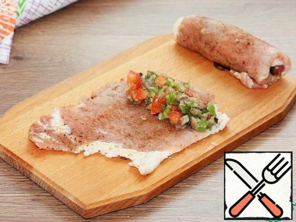 Then put the filling and roll the chop into a roll.