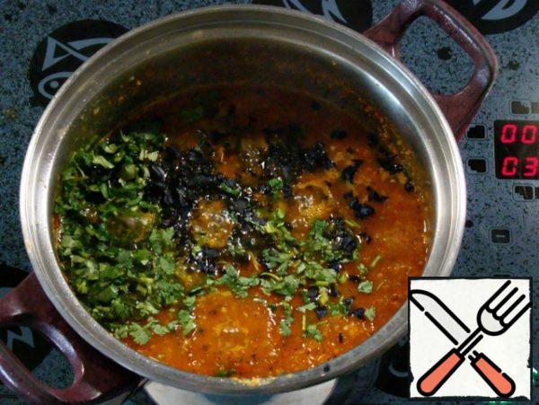 Add the chopped coriander and Basil to the sauce, mix everything together and cook for 10 minutes.