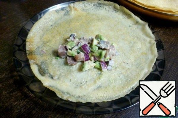 Stuff each pancake with the prepared filling. You can wrap it in an envelope, a tube, or a triangle. As your heart desires!