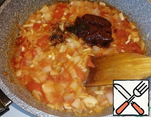 Add tomato paste. Add salt and pepper to taste. Pour in the water. Simmer for 4-5 minutes over low heat.