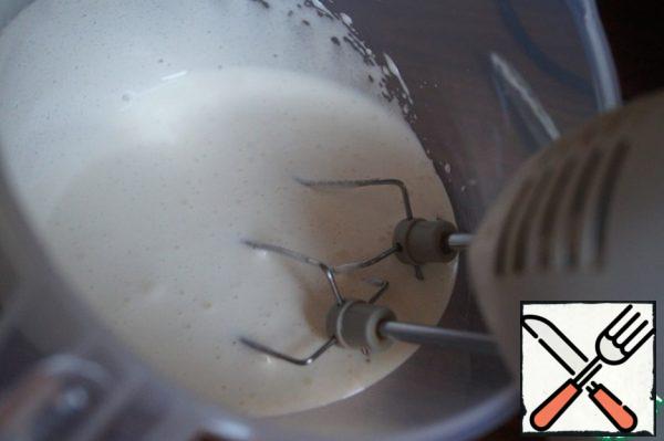 Beat eggs with sugar until white fluffy mass.