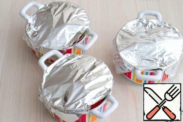 Cover the forms with foil and send them to a preheated t180-190C oven. Bake the dish for about 40-50 minutes.