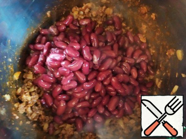 Add the beans and stir.