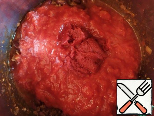 Add tomatoes and tomato paste and mix.