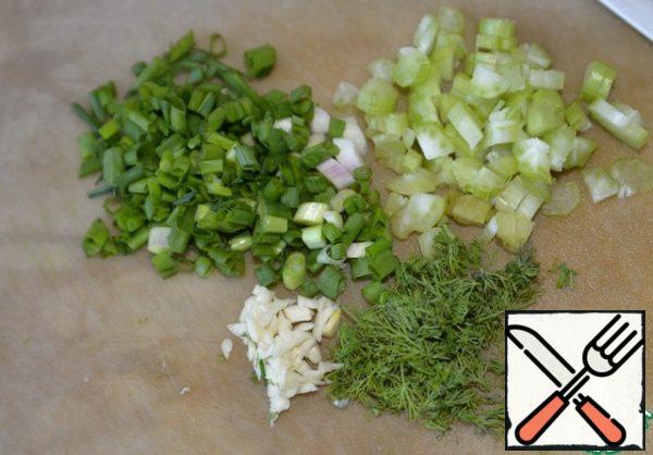 Finely chop the celery stalk, green onion, dill and garlic.