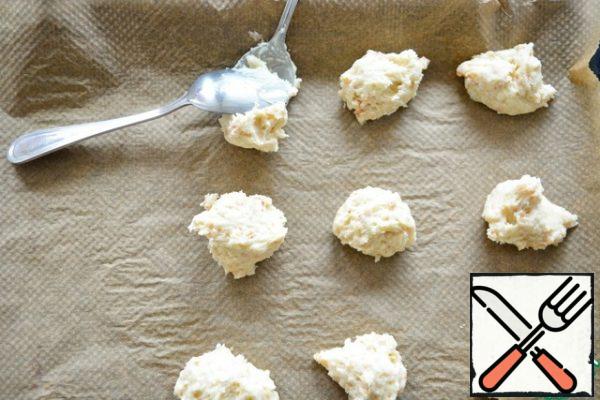 Spread the dough on a parchment lined baking sheet using two teaspoons.