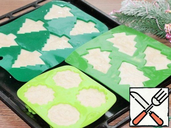 Spread the mass into silicone molds, filling them completely. Bake the souffle in a preheated oven for 30 to 40 minutes or until Golden. Do not open the oven while baking. Readiness can be checked with a dry splinter. After baking, allow time for the souffle to cool and remove from the molds. There will be shrinkage, but not much.