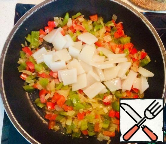 Add the squid pieces to the vegetables