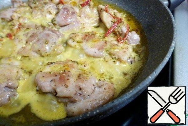 Pour the sauce into the pan, turn down the heat and simmer the thighs in the sauce under the lid for 20-25 minutes. The sauce covered the chicken pieces in half, so I turned them to the other side during cooking.