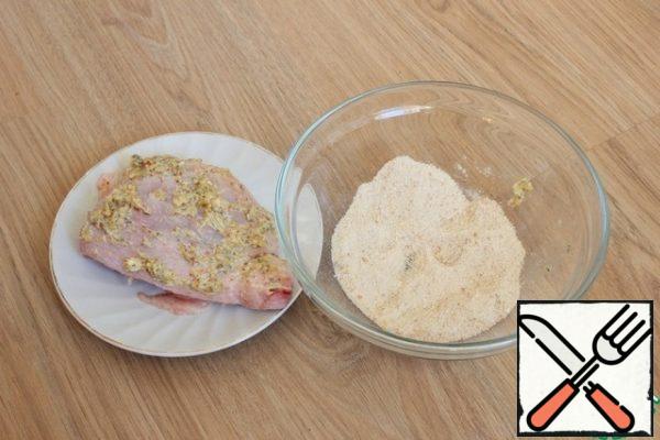 Chicken thighs are liberally lubricated with mustard mixture from all sides.