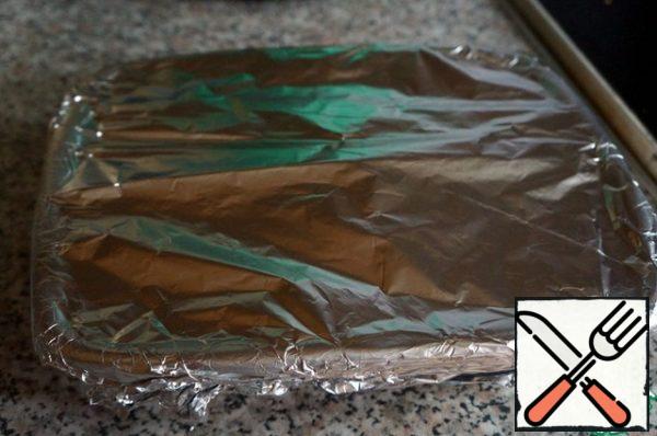 Cover the mold with foil.