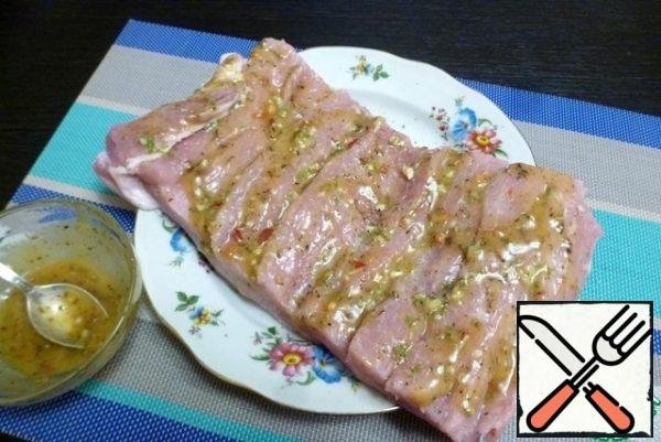 Brush with the prepared mustard-lime marinade with spices. Try to get the marinade into the cuts too.