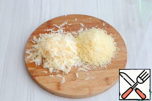Grate the parmesan and dutch cheese and mix.