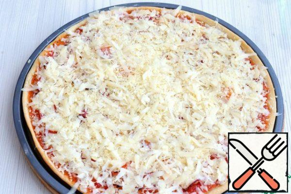 Then take out the form and sprinkle with a mixture of grated cheeses on top and send it back to the oven for 5-7 minutes.