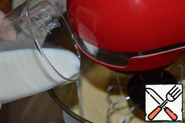 Slowly pour in the milk.