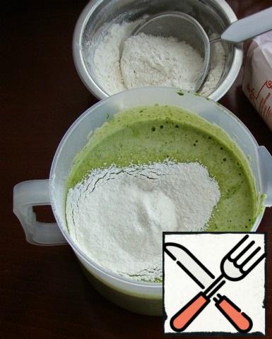 Then pour in the flour sifted with baking powder and mix everything carefully with a spatula.
Pour the dough into a mold (18 cm in diameter) and put it in a preheated 170 - 180* oven, for about 35-40 minutes ( you need to focus on your oven).
